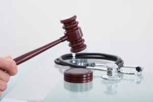 Judges gavel and a stethoscope in a conceptual image