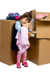 The joys of moving from one place to another. A young girl hugs her bunny as her bedroom is packed up